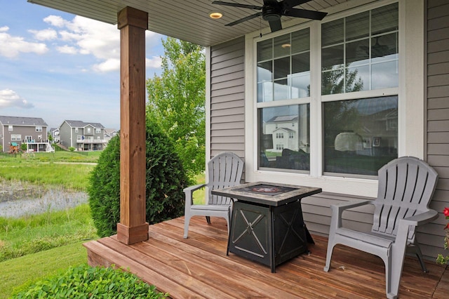 17552 57th St NE, Otsego, MN 55374 - wooden terrace with a fire pit, a ceiling fan, and a residential view