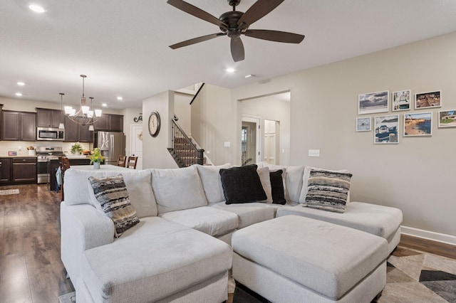 17552 57th St NE, Otsego, MN 55374 - living room with dark wood-style floors, stairs, recessed lighting, a ceiling fan, and a chandelier