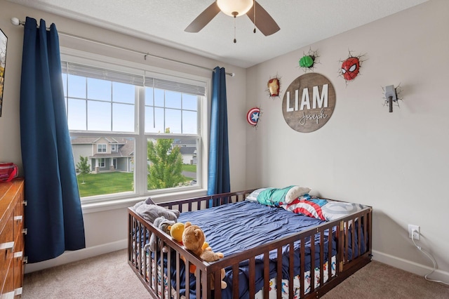 17552 57th St NE, Otsego, MN 55374 - carpeted bedroom with baseboards and ceiling fan