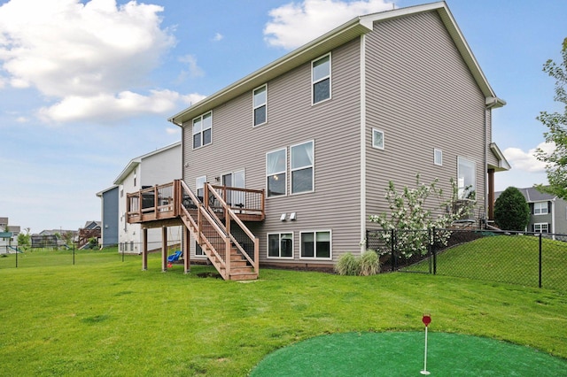 17552 57th St NE, Otsego, MN 55374 - back of property with stairway, a putting green, a fenced backyard, and a wooden deck