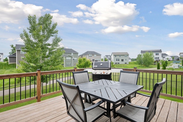 17552 57th St NE, Otsego, MN 55374 - wooden terrace featuring a residential view, outdoor dining space, a lawn, and a grill