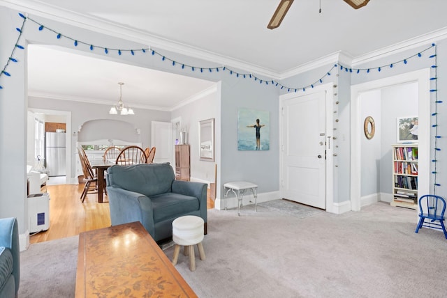 952 Goodrich Ave, Saint Paul, MN 55105 - living room with crown molding, ceiling fan, and a chandelier