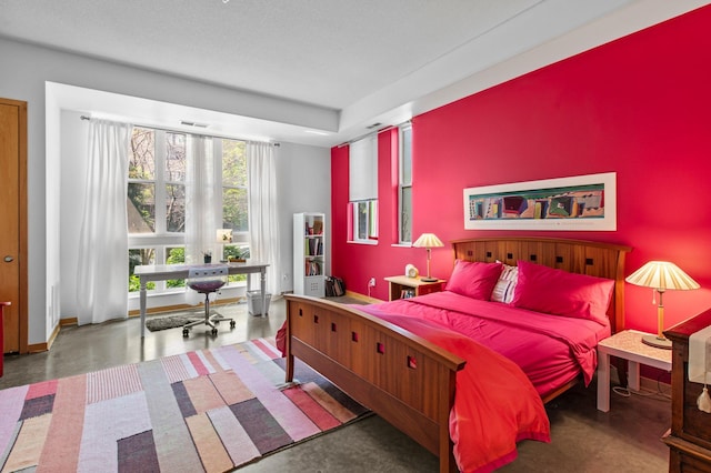 2650 University Ave W Unit 1, Saint Paul, MN 55114 - bedroom with finished concrete floors and baseboards