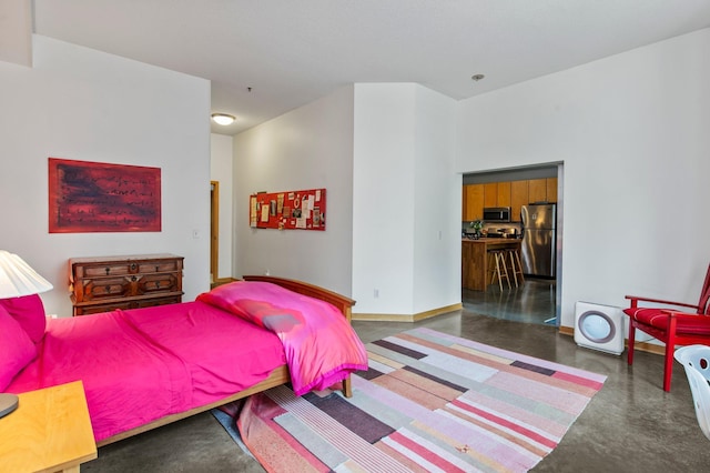 2650 University Ave W Unit 1, Saint Paul, MN 55114 - bedroom featuring freestanding refrigerator and finished concrete flooring