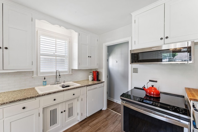 5605 Logan Ave S, Minneapolis, MN 55419 - kitchen featuring stainless steel appliances, wood finished floors, white cabinets, and tasteful backsplash