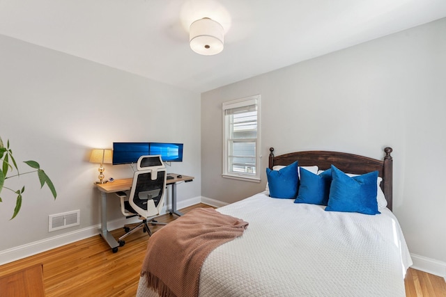 5605 Logan Ave S, Minneapolis, MN 55419 - bedroom featuring wood finished floors and an office area