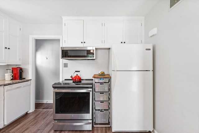 5605 Logan Ave S, Minneapolis, MN 55419 - kitchen with stainless steel appliances, wood finished floors, and white cabinetry