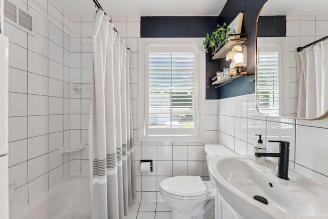 5605 Logan Ave S, Minneapolis, MN 55419 - full bathroom featuring tile walls, shower / bath combo, vanity, and tile patterned flooring