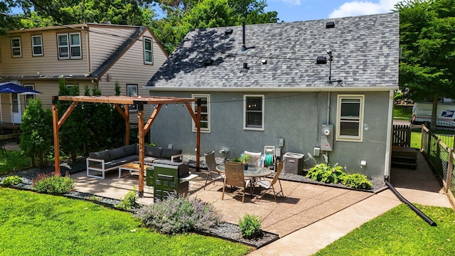 5605 Logan Ave S, Minneapolis, MN 55419 - back of house featuring an outdoor living space, stucco siding, roof with shingles, and a patio