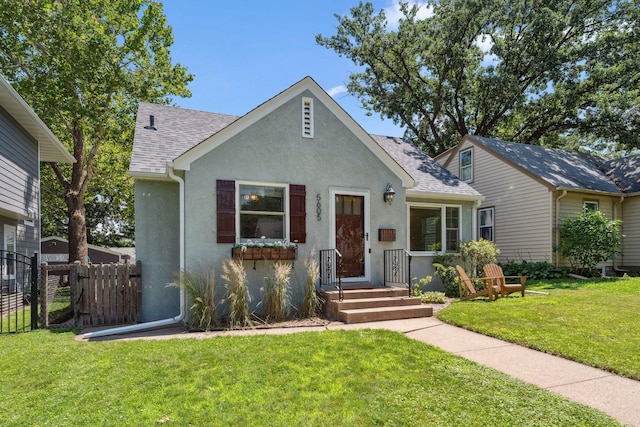5605 Logan Ave S, Minneapolis, MN 55419 - view of front facade with stucco siding and a shingled roof