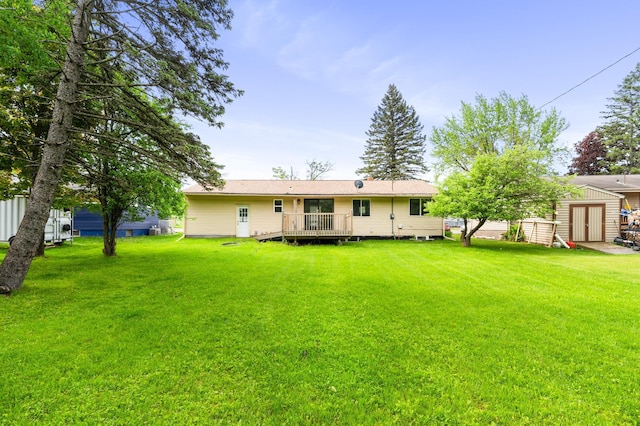 1229 Arrowhead Rd, Duluth, MN 55811 - rear view of property with a yard, a deck, and an outdoor structure