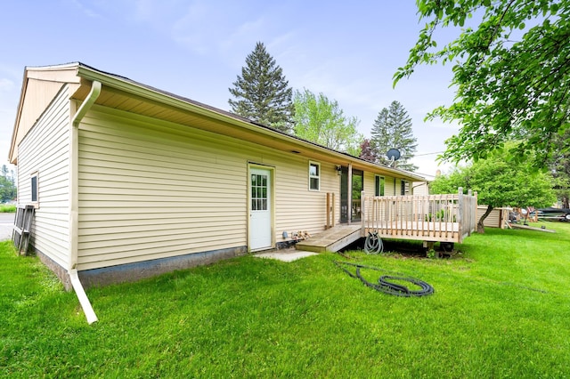 1229 Arrowhead Rd, Duluth, MN 55811 - rear view of house featuring a wooden deck and a lawn