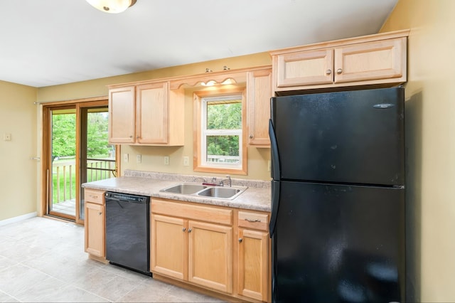 1229 Arrowhead Rd, Duluth, MN 55811 - kitchen with black appliances, light brown cabinets, light countertops, and light tile patterned floors