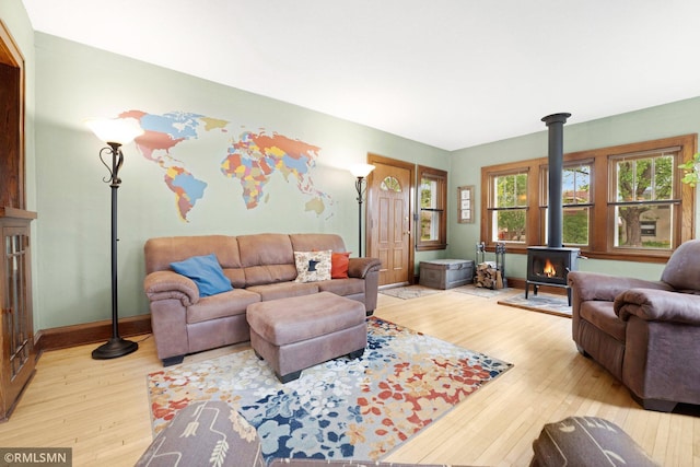 5116 28th Ave S, Minneapolis, MN 55417 - living room with a wood stove, wood-type flooring, and baseboards