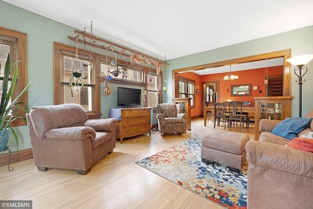 5116 28th Ave S, Minneapolis, MN 55417 - living room featuring wood finished floors and a chandelier