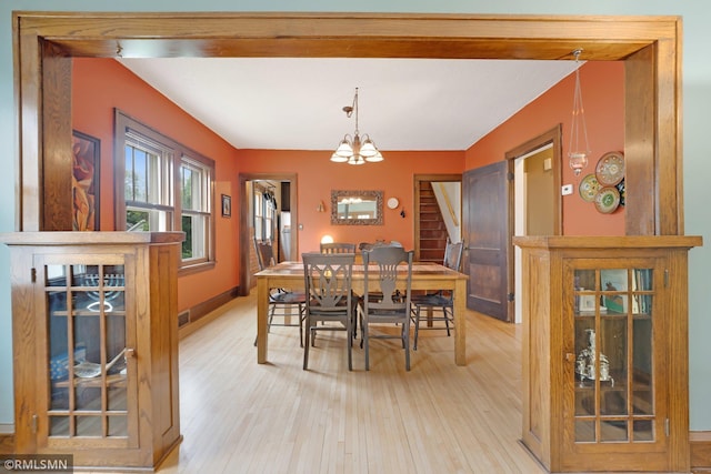 5116 28th Ave S, Minneapolis, MN 55417 - dining space with light wood-type flooring, a chandelier, and baseboards