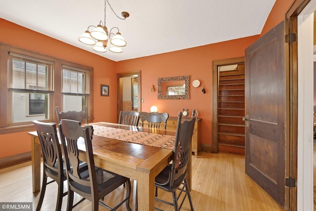 5116 28th Ave S, Minneapolis, MN 55417 - dining space featuring light wood-type flooring, a chandelier, and baseboards
