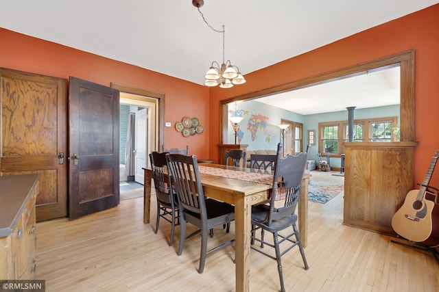 5116 28th Ave S, Minneapolis, MN 55417 - dining room featuring light wood finished floors and a chandelier