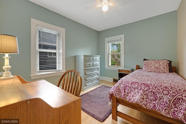 5116 28th Ave S, Minneapolis, MN 55417 - bedroom featuring wood finished floors, baseboards, and ceiling fan