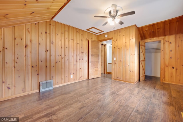 5116 28th Ave S, Minneapolis, MN 55417 - unfurnished bedroom with wooden walls, wood finished floors, vaulted ceiling, and a ceiling fan