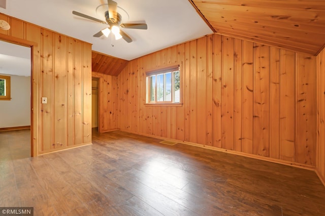 5116 28th Ave S, Minneapolis, MN 55417 - additional living space featuring lofted ceiling, wood walls, wood finished floors, a ceiling fan, and baseboards