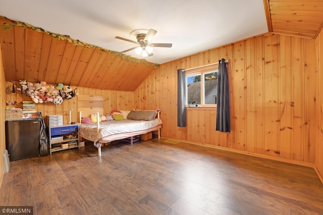 5116 28th Ave S, Minneapolis, MN 55417 - bedroom featuring vaulted ceiling, wood finished floors, wood walls, and a ceiling fan