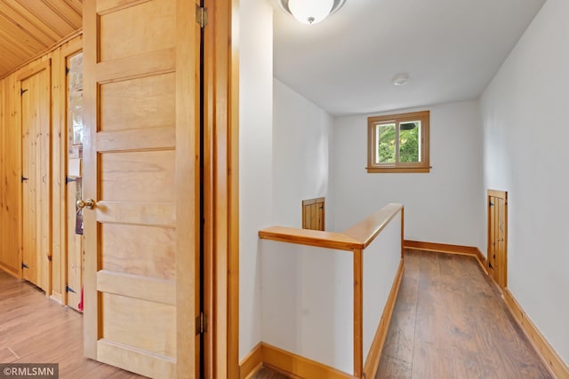 5116 28th Ave S, Minneapolis, MN 55417 - corridor with an upstairs landing, wood finished floors, baseboards, and vaulted ceiling