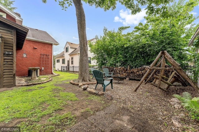 5116 28th Ave S, Minneapolis, MN 55417 - view of yard with a fire pit and central air condition unit