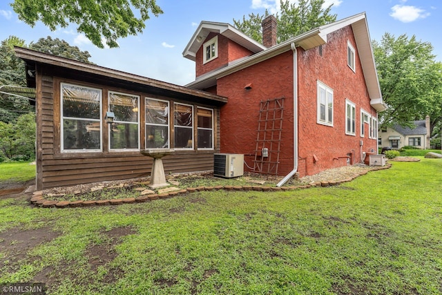 5116 28th Ave S, Minneapolis, MN 55417 - back of property with central AC, a chimney, and a yard