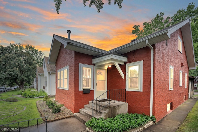 5116 28th Ave S, Minneapolis, MN 55417 - view of front of home featuring stucco siding and a front yard