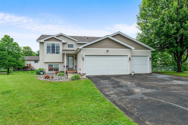 920 Lincoln Ct S, Cambridge, MN 55008 - tri-level home featuring driveway, an attached garage, and a front yard