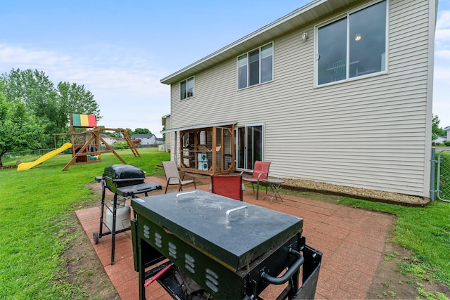 920 Lincoln Ct S, Cambridge, MN 55008 - rear view of property with a lawn and a playground