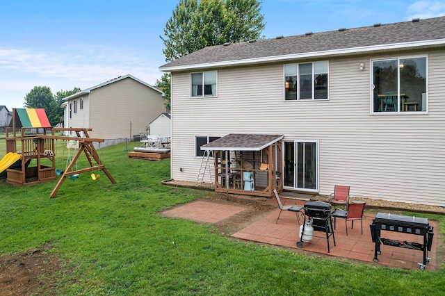 920 Lincoln Ct S, Cambridge, MN 55008 - back of property featuring a patio, a playground, and roof with shingles