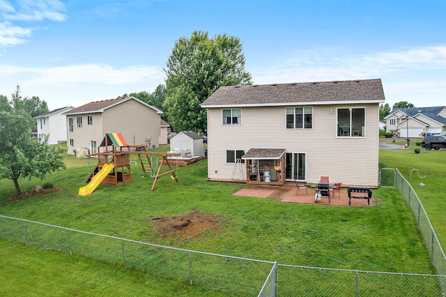 920 Lincoln Ct S, Cambridge, MN 55008 - back of house with a playground, a patio area, and a fenced backyard