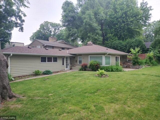 1872 Mississippi River Blvd S, Saint Paul, MN 55116 - view of front of house featuring a front lawn and a chimney