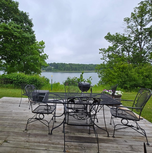 35163 Rose Lake Dr, Frazee, MN 56544 - deck featuring outdoor dining space, a water view, and a grill