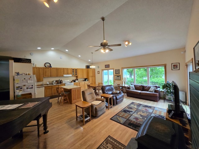 35163 Rose Lake Dr, Frazee, MN 56544 - living room with light wood-style flooring, a ceiling fan, high vaulted ceiling, and recessed lighting