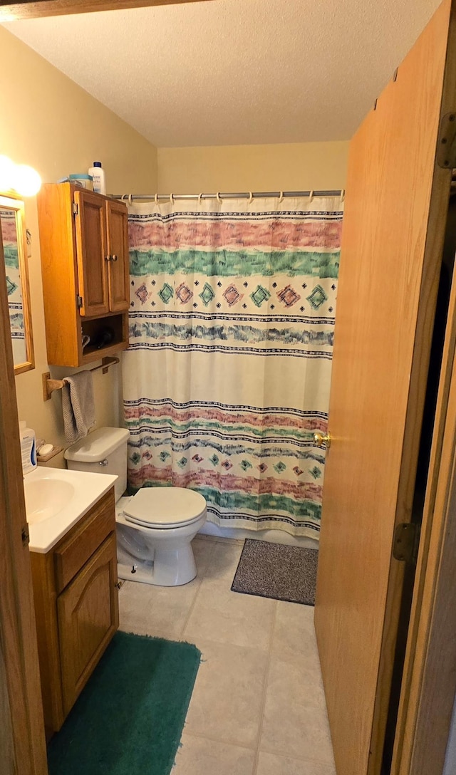 35163 Rose Lake Dr, Frazee, MN 56544 - full bathroom featuring vanity, a textured ceiling, tile patterned flooring, and a shower with shower curtain