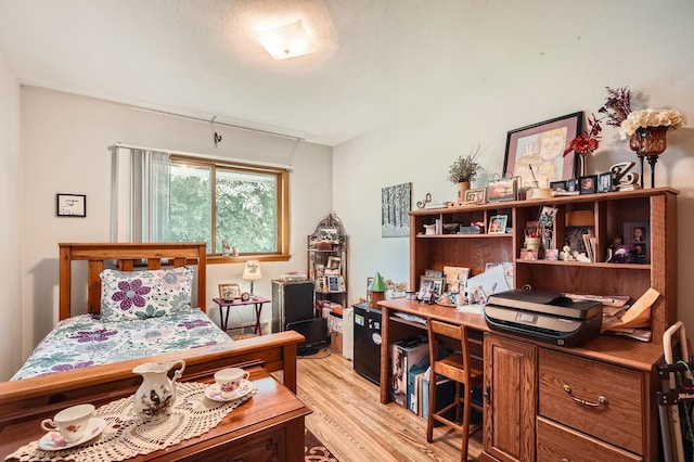 2226 S Ave E, North Saint Paul, MN 55109 - bedroom with light wood-style floors and an office area