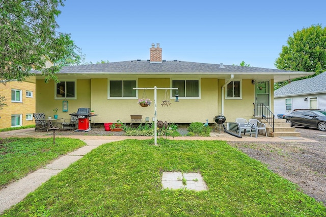 2226 S Ave E, North Saint Paul, MN 55109 - rear view of property with a lawn, a chimney, and stucco siding