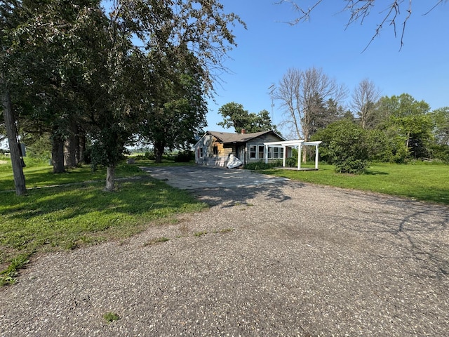 16005 Sherwood Trl, Minneola Twp, MN 55992 - view of front of property with driveway, a chimney, and a front yard