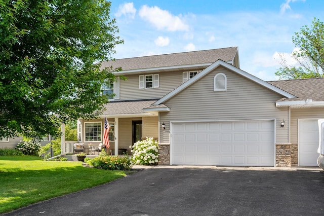 12864 Fondant Trl N, Hugo, MN 55038 - view of front facade featuring roof with shingles, stone siding, and asphalt driveway