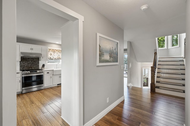 12864 Fondant Trl N, Hugo, MN 55038 - corridor with light wood-type flooring and stairs