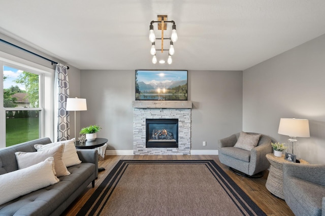 12864 Fondant Trl N, Hugo, MN 55038 - living area with wood finished floors and a fireplace