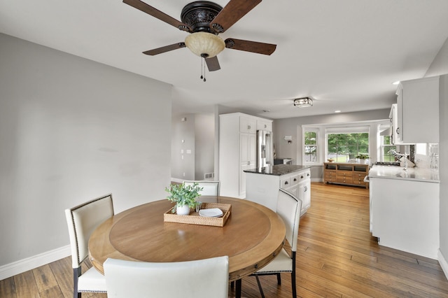 12864 Fondant Trl N, Hugo, MN 55038 - dining space featuring ceiling fan and light wood finished floors