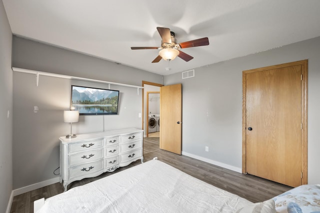 12864 Fondant Trl N, Hugo, MN 55038 - bedroom with wood finished floors, washer / dryer, ceiling fan, and a closet