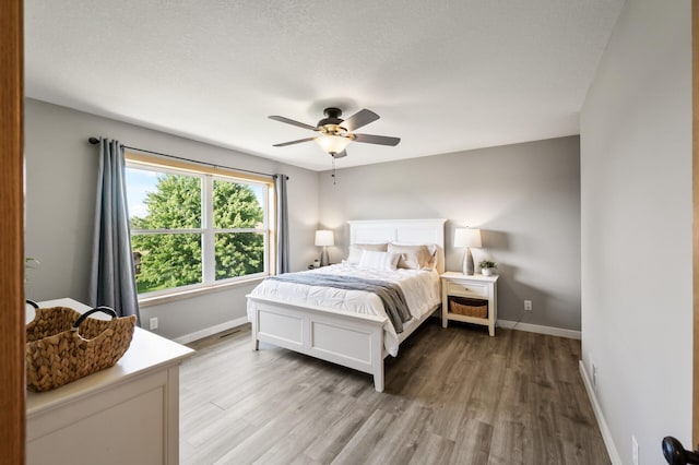 12864 Fondant Trl N, Hugo, MN 55038 - bedroom with light wood-style floors and a ceiling fan