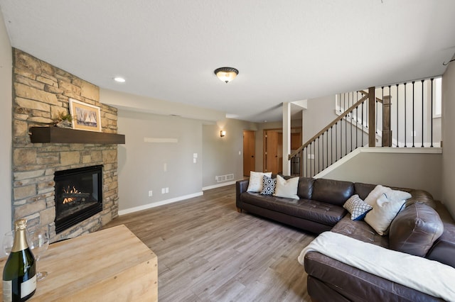 12864 Fondant Trl N, Hugo, MN 55038 - living area with wood finished floors, a fireplace, and stairway