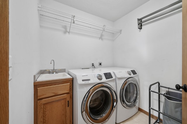 12864 Fondant Trl N, Hugo, MN 55038 - laundry area featuring washing machine and clothes dryer and cabinet space