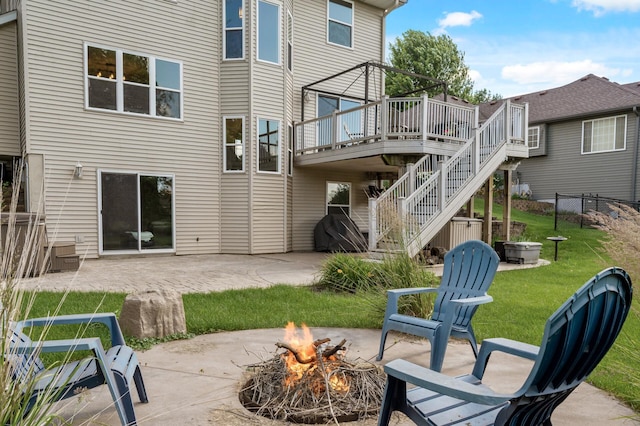 12864 Fondant Trl N, Hugo, MN 55038 - rear view of property featuring a fire pit, stairway, a wooden deck, and a patio area